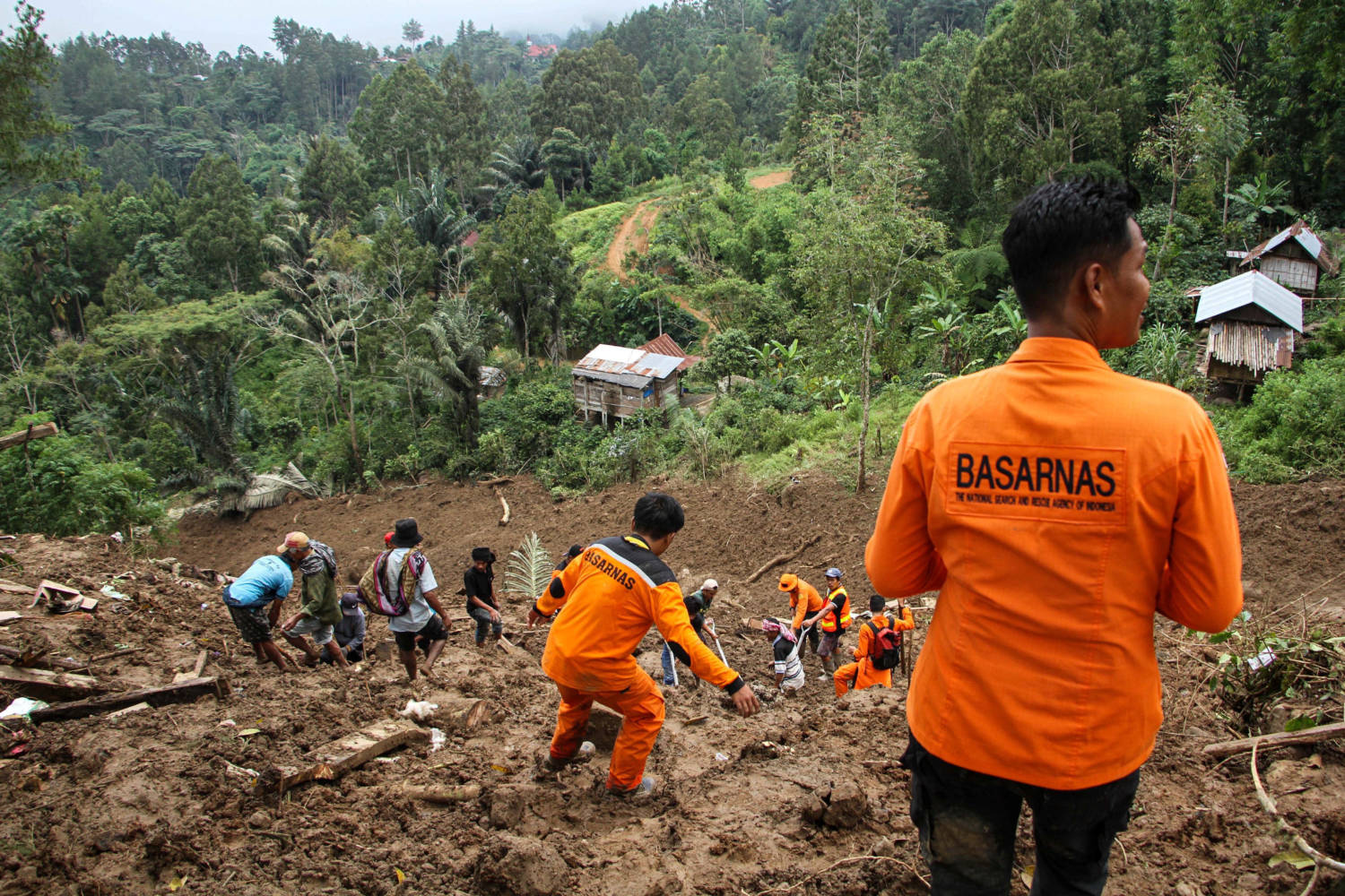 Indonesian Rescue Members With Residents Evacuated People From The Site Of A Landslide Triggered By High Intensity Rains, That Affected Two Villages In Tana Toraja
