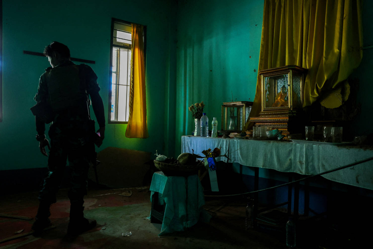 A Soldier From The Karen National Liberation Army (knla) Inspects Inside A High Rank Myanmar Soldier House At A Myanmar Military Base At Thingyan Nyi Naung Village On The Outskirts Of Myawaddy