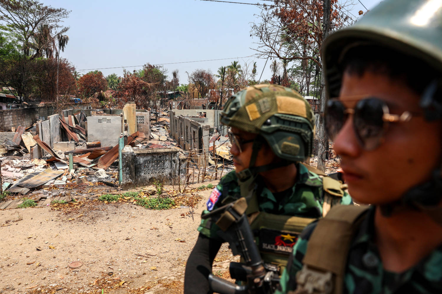File Photo: Soldiers From The Karen National Liberation Army (knla) Patrol , Next To An Area Destroyed By Myanmar's Airstrike In Myawaddy, The Thailand Myanmar Border Town Under The Control Of A Coalition Of Rebel Forces Led By The Karen National Union