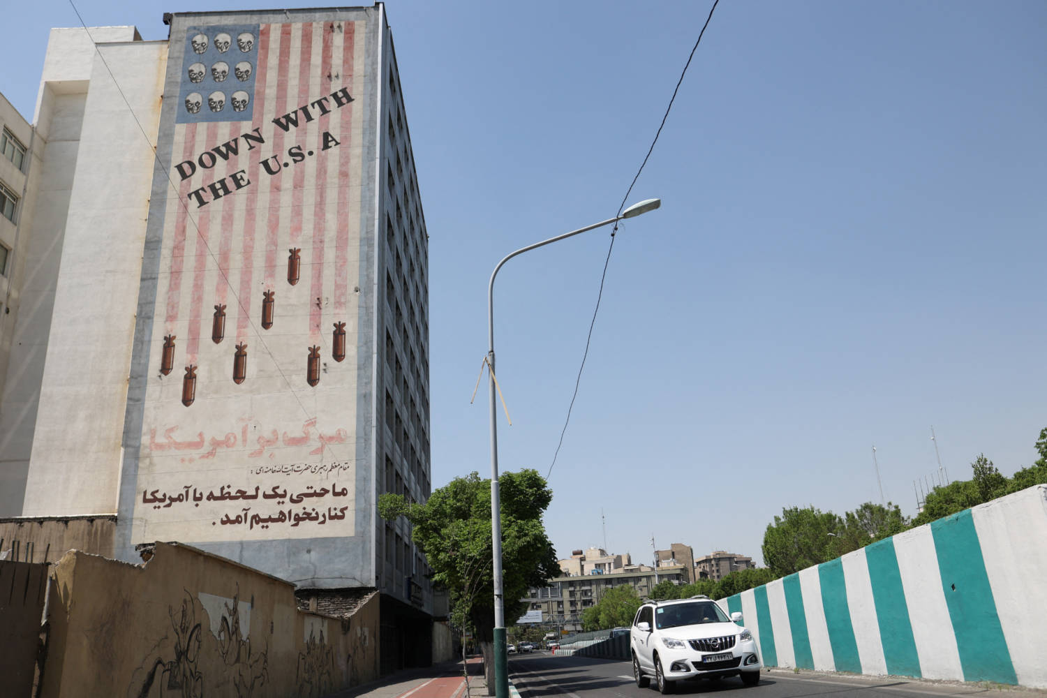 An Anti U.s. Mural Is Seen On A Wall On A Street In Tehran