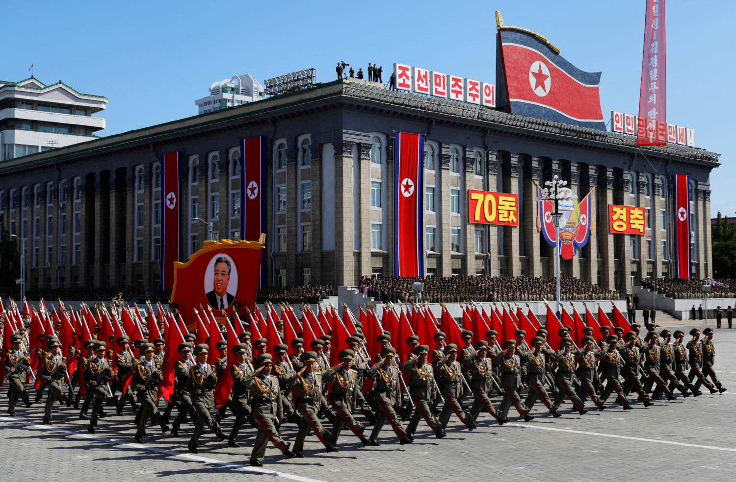 File Photo: Soldiers March With The Portrait Of North Korean Founder Kim Il Sung During A Military Parade Marking The 70th Anniversary Of Country's Foundation In Pyongyang