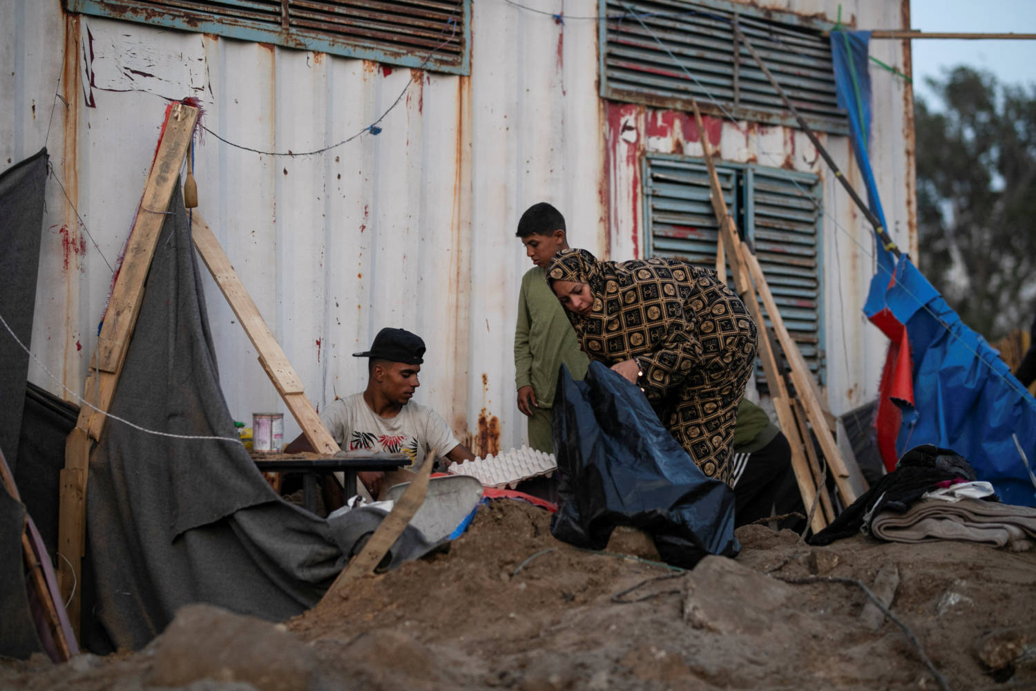 Displaced Palestinians Inspect The Site Of An Israeli Strike On A Tent Camp, In Rafah