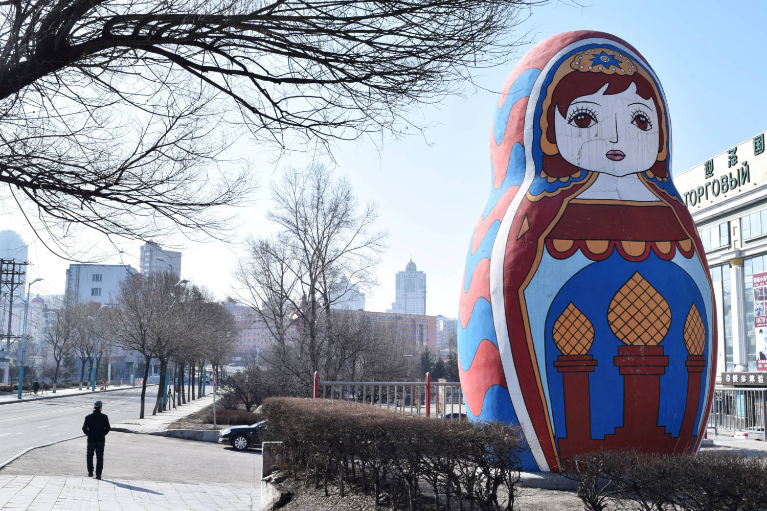 File Photo: Man Walks Past A Giant Statue Of A Russian Matryoshka Doll On A Street In Suifenhe, A City Of Heilongjiang Province On The Border With Russia, As The Spread Of The Novel Coronavirus Disease (covid 19) Continues In The Country