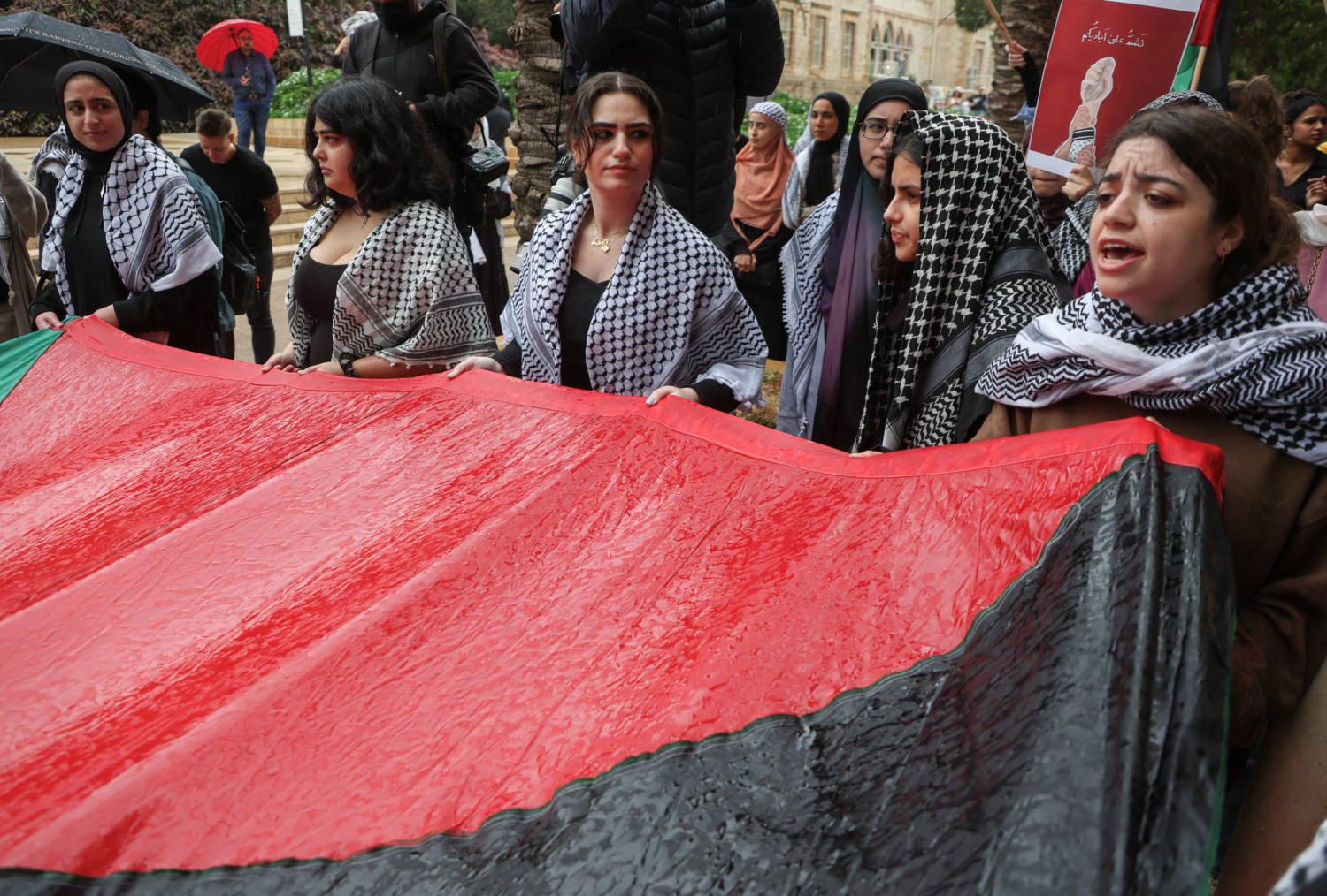 Students Hold A Palestinian Flag During A Protest In Solidarity With Gaza At The American University Of Beirut