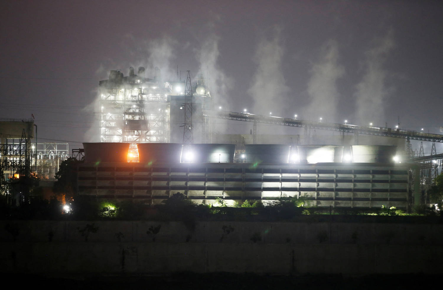 File Photo: Smoke Billows From The Cooling Towers Of A Coal Fired Power Plant In Ahmedabad