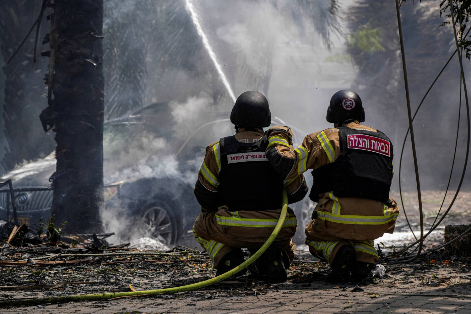 Firefighters Work To Put Out A Fire At The Impact Site Of A Rocket That Was Fired Towards Israel From Lebanon, Amid Ongoing Cross Border Hostilities Between Hezbollah And Israeli Forces, In Kiryat Shmona