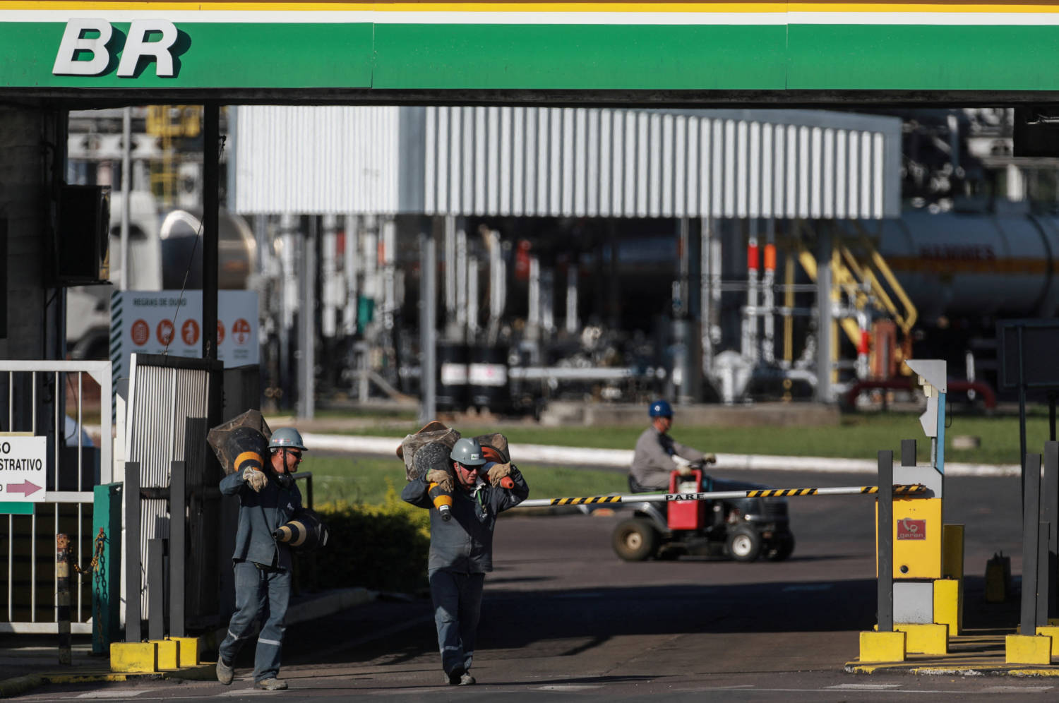 File Photo: Workers Walk In Front Of The Entrance Of The Petrobras Alberto Pasqualini Refinery In Canoas