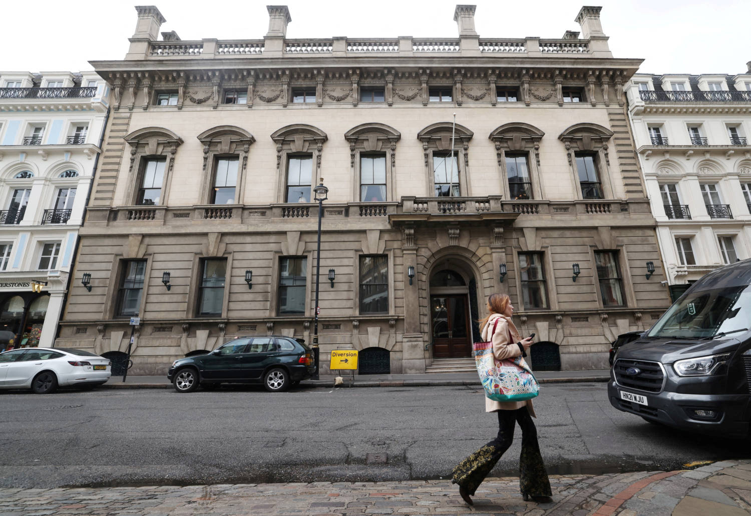File Photo: A Person Walks Past The Entrance To The Garrick Club In London